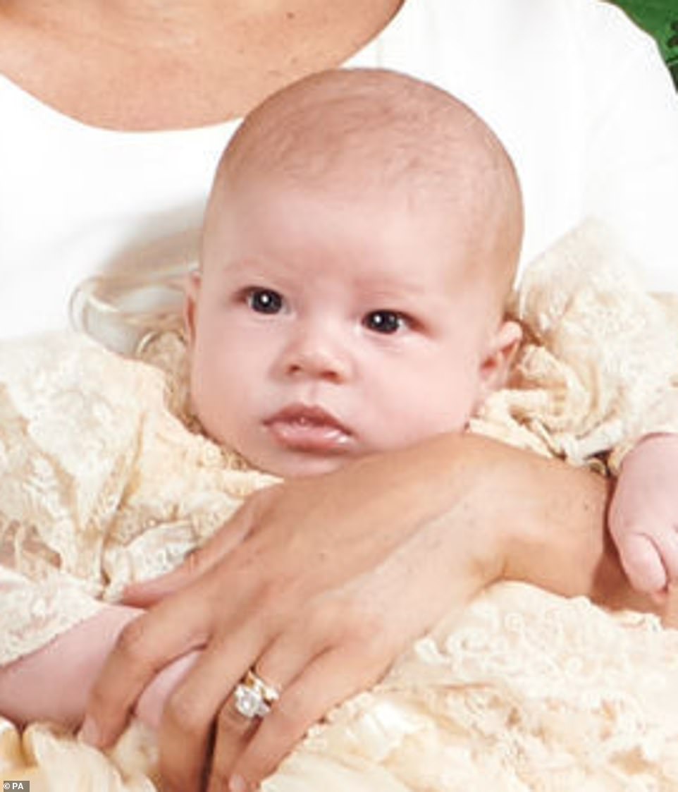 Finally baby Archie's face is revealed! The stunning snap shows off the adorable royal, with the little boy being held by mother Meghan Markle