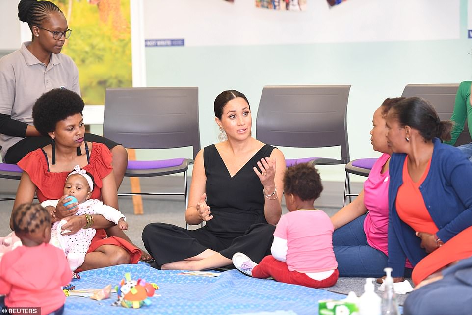 Meghan met health workers and families during a visit to the mothers2mother charity organisation in Cape Town