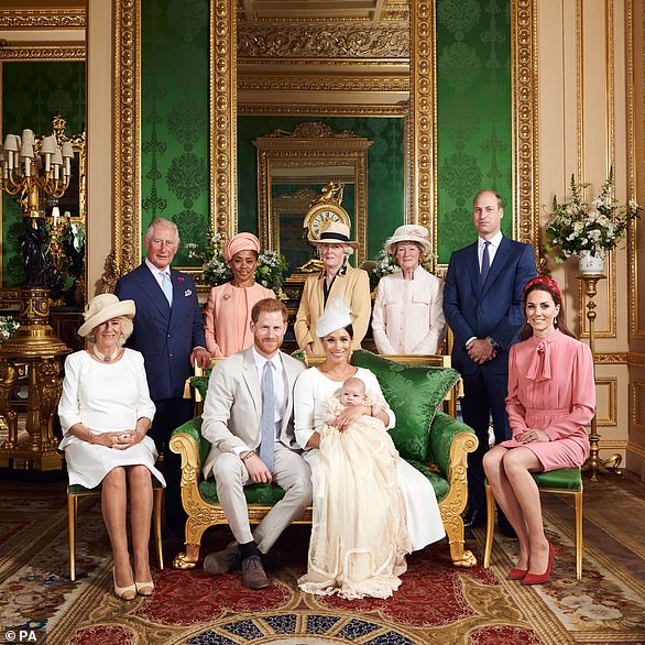 This official christening photograph released by the Duke and Duchess of Sussex shows the Duke and Duchess with their son, Archie and (left to right) the Duchess of Cornwall, The Prince of Wales, Ms Doria Ragland, Princess Diana's sisters Lady Jane Fellowes, Lady Sarah McCorquodale, The Duke of Cambridge and The Duchess of Cambridge in the Green Drawing Room at Windsor Castle