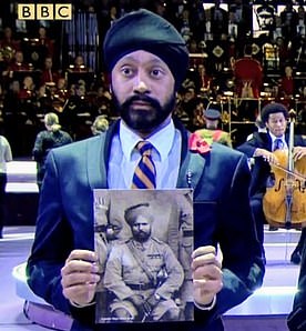 Dr Tejpal Singh Ralmill with a photo of his great-great grandfather Major Bawa Singh at a Royal Albert Hall Remembrance event