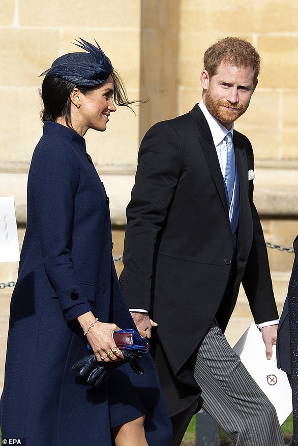 Harry and Meghan attended the wedding of his cousin Princess Eugenie in Windsor on 12 October 2018 (pictured) - where they told the Queen and the royal family they were expecting and she was wearing a wide fitting coat