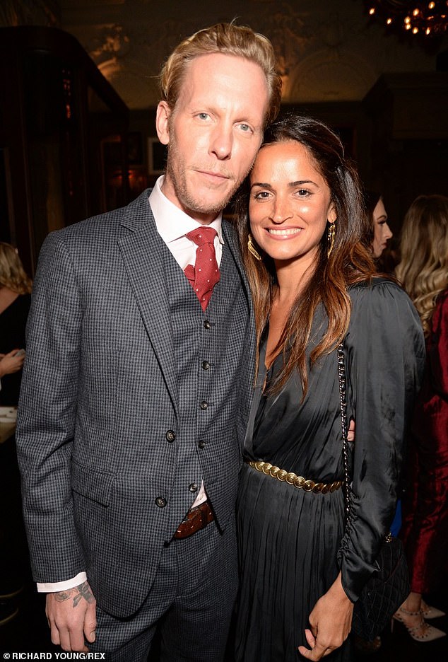 Love: Laurence pictured with Sara at the GQ Men's Dinner on January 6