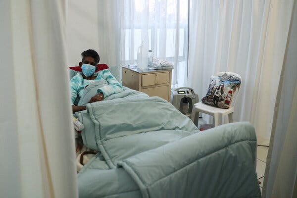 A Covid patient at a hospital in Johannesburg on Saturday. The effect of the Delta variant in Africa has seen hospitalizations rise, while deaths have surged 43 percent in the past week on the continent.