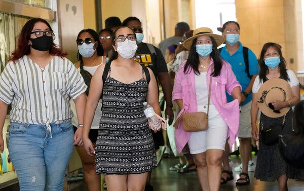 Visitors in a Hollywood shopping district wore masks earlier this month. Los Angeles County is currently averaging over 1,000 new cases per day.