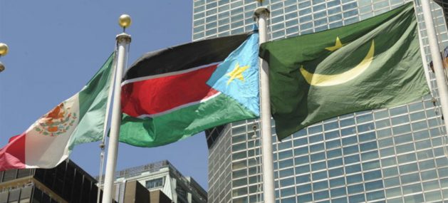 South Sudan’s national flag (centre) flies at UN Headquarters following its admission as the 193rd Member State. Credit: UN/E. Schneider