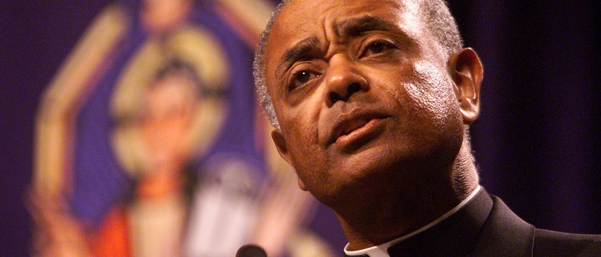 Bishop Wilton Gregory addresses the opening session of the United States Conference of Catholic Bishops opening session at the Fairmont Hotel in Dallas, Texas on June 13, 2002. - Gregory, from Belleville, Illinois is the president of the US Conference of Catholic Bishops and the first African-American to head the group. (Photo by Rick WILKING / REUTERS POOL / AFP) (Photo by RICK WILKING/REUTERS POOL/AFP via Getty Images)