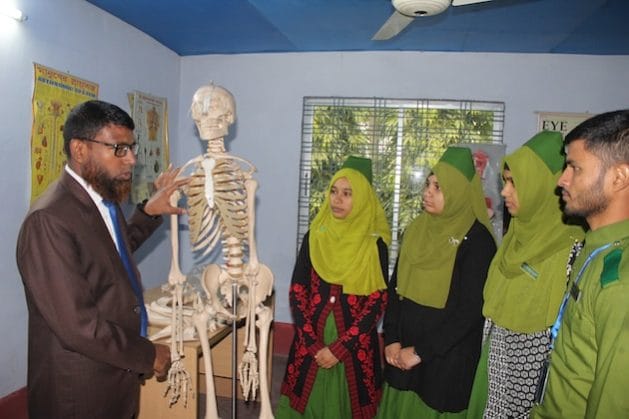 Dr MA Sayed conducts a practical class with his students at the Moimuna Nursing Institute. Credit: Rafiqul Islam/IPS