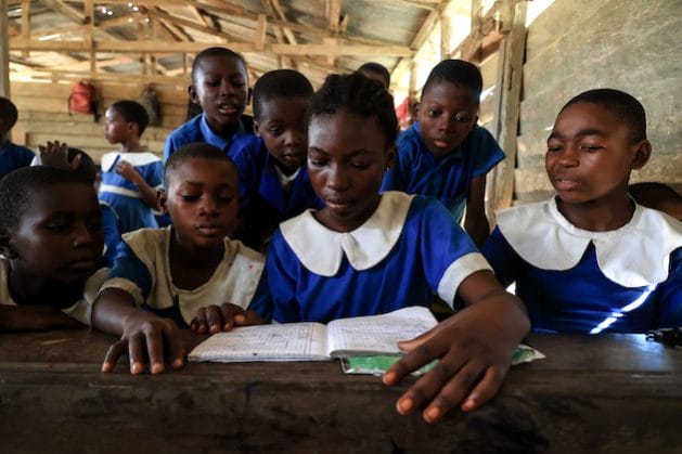 Students attending class at the Souza Gare school in the Littoral region, Cameroon. The school hosts displaced children who have fled the violence in the North-West and South-West regions. Photo credits: ECW/Daniel Beloumou