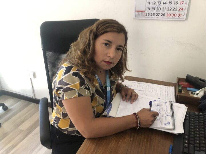 Paloma Olivares, president for Santiago of the women's organization Yo Cuido, works in her office in the working-class municipality of Estación Central, in the northeast of the Chilean capital. CREDIT: Orlando Milesi / IPS