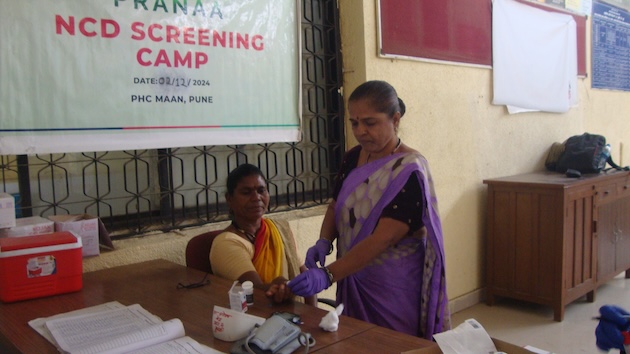 A patient being checked for BP at Mann PHC. Credit: Rina Mukherji/IPS