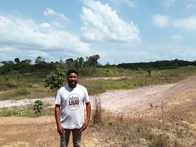 Fabio Nogueira, a leader of the Menino Jesus Quilombola Afro-descendant community, stands in front of a proposed landfill, which is 500m from their homes. Credit: Joyce Chimbi/IPS