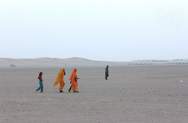 Sahrawi refugees walk near the Awserd Refugee Camp in the Tindouf Province of Algeria. Credit: UN Photo/Evan Schneider