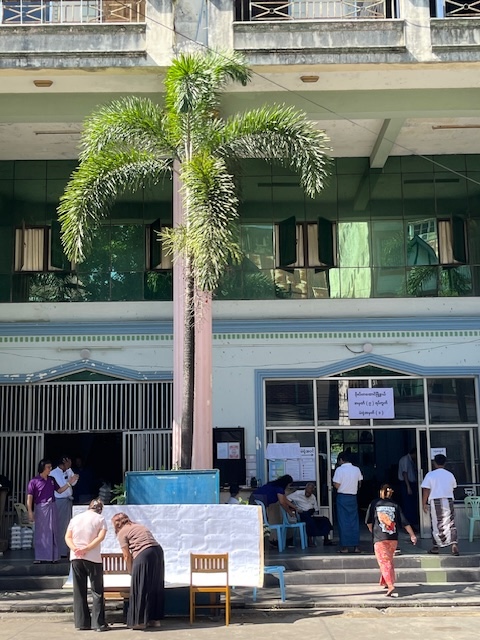 Residents in downtown Yangon check their names on the electoral register and then cast their votes in a polling station on December 28. Credit: Guy Dinmore/IPS