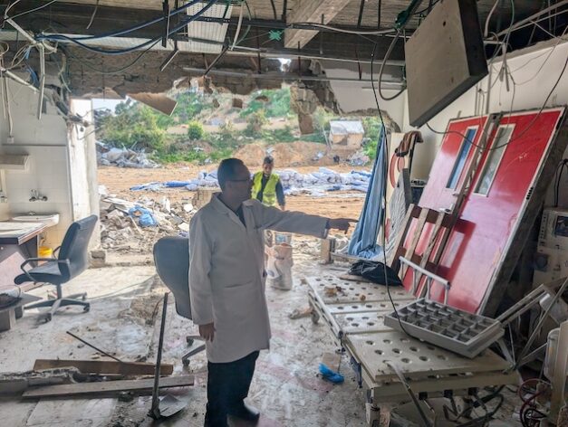 Cardiologist Dr. Marwan Sultan, then Director of the Indonesian Hospital in north Gaza, in February 2025 showing damage to hospital equipment following an Israeli attack on the facility a few months prior. In July 2025, Dr. Sultan was killed in an Israeli strike on the apartment where he was sheltering with his family. Credit: PHR/GHRC