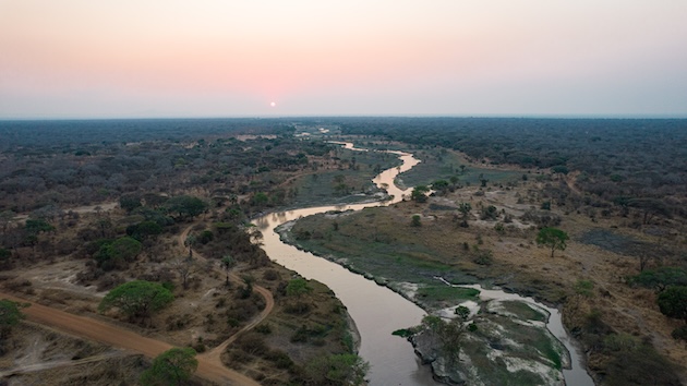The Ruvuma River winds through wetlands and forests in southern Tanzania, forming part of the natural border with Mozambique. The river sustains farming, fishing and wildlife across the vast Ruvuma River Basin, supporting millions of people who depend on its waters for their livelihoods. Credit: Kizito Makoye/IPS
