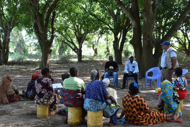 A group of community members gather outside an African Beekeepers Limited facility in Kenya’s Tana Delta. Credit: Chemtai Kirui/IPS